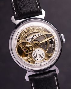 Experience the mesmerizing allure of the vintage Sputnik Skeleton watch - a captivating timepiece that unveils the intricate dance of mechanics and artistry. Unlike any other, this watch features a partial dial and exposed movement, allowing you to witness the inner workings with every glance. The delicate balance of the watch's mechanism mirrors the rhythmic beating of a heart, evoking a profound sense of connection and wonder. With each tick and tock, this timepiece creates a symphony of motion that resonates deep within. Encased in a versatile 35mm diameter, this watch effortlessly adorns any wrist, embodying timeless style and sophistication. At 6 o'clock, a unique circular second hand gracefully rotates, offering a mesmerizing display of time's passage. Elevate your wristwear collecti Steampunk Style Watch With Subdials As Gift, Evening Chronometer Round Watch, Round Chronometer Watch For Evening, Evening Round Chronometer Watch, Evening Chronometer Watch, Steampunk Watches With Round Dial For Formal Occasions, Steampunk Automatic Watch For Formal Occasions, Classic Watches With Rotating Bezel As Gift, Timeless Skeleton Dial Watch For Anniversary