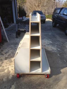 an empty shelf sitting in the middle of a driveway