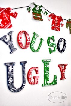 the word you're ugly spelled with christmas sweaters and snowflakes on a string