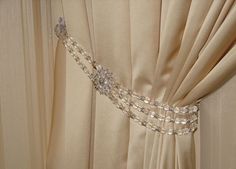 a close up of a curtain with beads on it