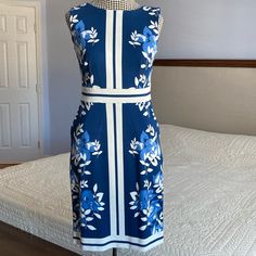 Beautiful Blue And White Banded Floral Sheath Dress Brand New, Never Worn Size: 0petite B10 Blue Sheath Dress With Lining, Blue Floral Fitted Knee-length Dress, Blue Lined Sheath Dress, Blue Floral Print Sheath Midi Dress, Spring Sleeveless Sheath Dress With Floral Print, Spring Floral Print Sheath Sleeveless Dress, Blue Sheath Dress Lined, Light Blue Floral Print Knee-length Mini Dress, Floral Sheath Dress