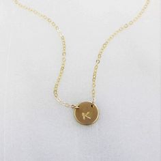 "This stunning petite initial necklace can be customized with a special initial of your choice. Choose from sterling silver, 14kt gold filled or rose gold filled. Classic and timeless, perfect for everyday wear. D E T A I L S -Petite disc measures 10mm - Choose from sterling silver, 14kt gold filled or rose gold filled. -A high quality delicate chain with a spring clasp. -Polished to a light satin finish. CUSTOM HAND STAMPING -Each disc is hand stamped with your initial -Choose your font in phot Delicate Chain, Necklace Dainty, Necklace Personalized, Simple Necklace, Gold Filled Jewelry, Dainty Necklace, Personalized Necklace, Silver Roses, Necklace Gift