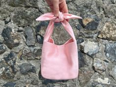 🔘 This Elegant Satin knot bag is ideal for the wedding day, night out, party, special occasion, brides, bridesmaids, mothers of the bride, or any formal fun 🔘 This  bag has an elastic opening and a stiff bottom   🔘 Please contact us for a custom order. 🔘 Material: Satin fabric or faux Silk. The lining fabric is the same fabric as on the outside. This bag has a magnetic snap closure inside. It also has a bottom shaper inside. 🔘 Measurements: Bottom Length x Height x Depth; 16 x 16 x 10 cm / 6,3'' x 6,3'' x 4'' 🔘 Care instruction: Hand wash in luke water. Square Bucket Bag With Dust Bag As Gift, Chic Square Bucket Bag As Gift, Pink Rectangular Bucket Bag As Gift, Pink Rectangular Bucket Bag For Gift, Pink Shoulder Bucket Bag For Gift, Pink Shoulder Bucket Bag As Gift, Chic Pink Bucket Bag As Gift, Elegant Summer Box Bag Suitable For Gifts, Elegant Summer Box Bag Perfect For Gifts