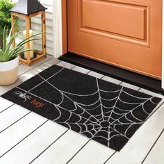 a door mat with a spider web on it