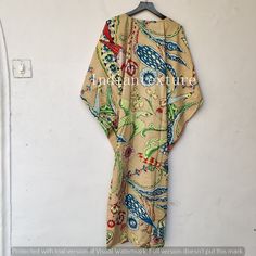 "This Beautiful Indian Cotton Caftan or can be called as Tunic is made with super fine quality cotton and designs have been crafted by Hand Prints. Measurements :- Size - Free Size Length -130 Cm /52\" Inches Bust/chest size - 120 CM/ 48\" Inches Fabric - 100% Cotton Pattern - Floral Kaftan has Adjustable Drawstring Waist to loose or tight , Kaftan has V Shape Neck Which is 8\" Inches Deep. Kaftan Is Multi-purposeand can be worn as a cover up at the Beach ,Loumge wear ,sleepwear ,Pregnant Women Beige Kaftan For Festival Beachwear, Patterned Long Kaftan For Beach, Long Patterned Kaftan For Beach, Long Patterned Kimono For The Beach, Beige Long Kaftan For Vacation, Patterned Long Beach Kaftan, Beige Spring Kaftan For Beachwear, Beige Floral Print Beach Kimono, Spring Beachwear Beige Kaftan