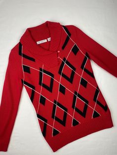 "Vintage Liz Claiborne, argyle preppy style THE DETAILS: Vibrant red w black & white argyle pattern, stretchy knit, long sleeve, rolled collar w button closure, soft & comfy, solid red back, tag states petite ~ Era: 90's ~ Material: Cotton ~ Garment Tag Size: Petite S ~ Today's Fit Guesstimate: XS/S ~ Condition: Excellent, no flaws  ~ Brand: Liz Claiborne ~ Pockets: no ~ Shoulder pads: no MEASUREMENTS (Flat Lay): ~ Shoulder to Shoulder \" ~ Bust/Pit to Pit 17\" ~ Waist/Width 13\" ~ Length 25\" *Compare personal measurements for proper fit  - Ships quickly - Message with questions - Shop with confidence - No surprises here -  Perfectly imperfect vintage charm may exist, but that's the sustainability appeal!" Fitted Plaid Long Sleeve Sweater, Fitted Long Sleeve Plaid Sweater, Fitted Argyle Pattern Tops For Winter, Fitted Argyle Pattern Sweater For Fall, Fall Fitted Argyle Sweater, Fitted Argyle Sweater For Fall, Fall Season Argyle Sweater, Preppy Punk, Vintage Liz Claiborne