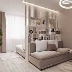 a living room with a couch, coffee table and bookshelf on the wall