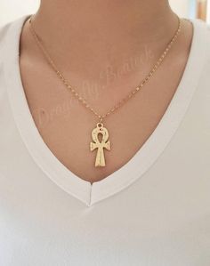 Gold Ankh Necklace For Women, Cross Necklace, Made of 14k Gold Heavy Plated Gold Over Quality Base Metal, High Quality Necklace #GoldCrossNecklace #NefertitiNecklace #WomensGoldCross #AfricaNecklace #EgyptianCross #GoldAnkhNecklace #GoldEgyptianCross #GoldCrossChain #14kGoldAnkh #14kGoldJewelry Silver Ankh Necklace In Brass, Spiritual Ankh Necklace With Adjustable Chain, Handmade Gold Ankh Necklace, Handmade Ankh Gold Necklace, Amulet Style Ankh Necklace In Brass, Symbolic Ankh Brass Necklace, Gold Ankh Necklace With Adjustable Chain, Brass Ankh Necklace For Gift, Gold Cross Amulet Necklace