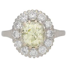 Fancy light yellow diamond cluster ring, circa 1950. | From a unique collection of vintage cluster rings at https://www.1stdibs.com/jewelry/rings/cluster-rings/ Canary Diamond Ring, Canary Yellow Diamonds, Vintage Cluster Ring, Canary Diamond, Fancy Lights, Yellow Diamond Rings, Cushion Cut Ring, Diamond Cluster Ring, Diamond Cluster