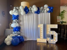 balloons and streamers decorate the entrance to a banquet hall for a 50th birthday party