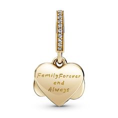 Take your love to new heights with the Sparkling Infinity Heart Dangle Charm. The front dangle is hand-finished in 14k gold and features an infinity symbol wrapped around a sparkling heart set with clear cubic zirconia. The back dangle is decorated with hand-applied shimmering silver enamel to provide the perfect backdrop and includes the love-filled engraving “Family forever and always." Gift this detailed charm to your loved one as a reminder of your close bond. Elegant Pendant Charms For Mother's Day, Elegant Mother's Day Pendant Charms, Elegant Heart Charms For Mother's Day, Elegant Charms For Anniversary And Mother's Day, Anniversary Jewelry With Removable Heart Charms, Gold Charms With Diamond Accents As Gifts, Gold Charms With Diamond Accents For Gifts, Dangling Charms Jewelry For Valentine's Anniversary, Elegant Infinity Charms Jewelry