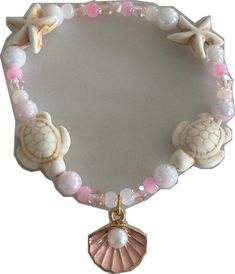 Adjustable Shell Pearl Bracelet For Beach, Pink Starfish Jewelry For Gift, Handmade Pink Ocean-inspired Jewelry, Coral Round Beads Bracelets For Beach, Coral Round Beads Bracelet For Beach, Coral Round Beaded Bracelets For Beach, Handmade Ocean-inspired Pink Jewelry, Pink Shell Ocean-inspired Jewelry, Coral Bracelet Jewelry For Beach