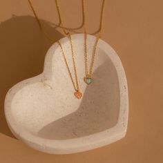 Celebrate the delicate beauty of our Pink Opal Heart Necklace, a charming and minimalistic accessory. Crafted with a heart-shaped pink opal, this dainty necklace not only adds a touch of elegance to your style but also showcases the unique properties of opal, making it a meaningful addition to your collection. Material: High Quality Solid 925 Sterling Silver Finish: Sterling Silver ∙ 18K Gold Featuring a ~5x5mm Pink Opal Heart Charm on an adjustable necklace from 16 to 18 inches Part of our Opal Dainty Heart Pendant Birthstone Necklace, Dainty Heart-shaped Birthstone Necklace As A Gift, Dainty Heart-shaped Birthstone Necklace Gift, Dainty Heart-shaped Birthstone Necklace With Gemstone, Dainty Gemstone Heart Pendant Necklace, Dainty Heart Necklace With Gemstone For Valentine's Day, Gold Pink Opal Necklace For Gifting, Gold Pink Opal Necklace For Gift, Dainty Heart-shaped Birthstone Charm Necklace