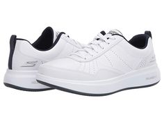 SKECHERS Performance Go Walk Steady - Men's Shoes : White/Navy : With a smooth action leather upper, cooling perforations, and premium cushioning, the SKECHERS Go Walk Steady sneaker will simplify your casual days with comfort and crisp style. Lace-up design offers a secure fit. Rounded toe. Leather overlays at the toe, sides, and heel provide stability. Relaxed Fit design provides room and comfort at the toe and forefoot. Padded tongue and collar. Rear pull-tab at the heel offers easy entry. Si Modern White Walking Shoes With Removable Insole, Comfortable Slip-resistant White Sneakers, White Leather Slip-resistant Walking Shoes, Comfortable White Slip-resistant Sneakers, White Leather Slip-resistant Sneakers, White Walking Shoes For Light Sports With Removable Insole, White Walking Shoes With Removable Insole For Light Sports, Classic White Walking Shoes With Ortholite Insole, White Slip-resistant Synthetic Walking Shoes