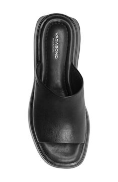 A gently flared platform sole brings statement-making height to a sleek and well-cushioned slide sandal topped with a supple strap. 2" platform Cushioned footbed Leather upper/synthetic lining and sole Imported Women's Shoes Women's Shoes, Vagabond Shoemakers, Platform Flats, Fabric Gift Bags, Dansko Professional Clog, Sandal Women, Women Style, Slide Sandals, Shoes Flats