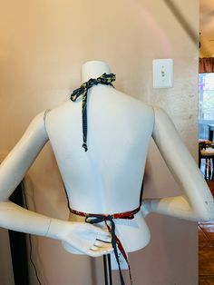 Gorgeous Kente halter top for summer days. Perfect for parties, beach and barbecue gatherings. Pair it with jeans, pants and shorts Top has adjustable strings to fit the body. Beautifully lined with a black fabric T-back Tie Back Halter Top For Vacation, Black Cropped Halter Top For Beach, Fitted Beachwear Crop Top For Beach Party, Summer T-back Tops For The Beach, Summer Halter Top With Built-in Bra And Adjustable Fit, Stretch Backless Halter Top For Festival, Festival Cropped Fitted Halter Top, Tie Back T-back Halter Top For Beach Season, Beach Season Halter Top With Built-in Bra And T-back