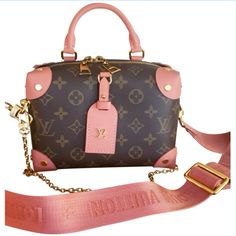 Authentic Louis Vuitton Monogram Petite Malle Souple! This Bag Features A Rolled Leather Top Handle, Gold Chain Shoulder Strap, An Adjustable Shoulder Strap And Double Zip Closure. One Interior Pocket. Handle And Shoulder Strap Are Detachable. Condition: Light Scuffs To Exterior Bottom Corners (Barely Noticeable When Wearing) Circa: 2020 Color: Pink, Brown Hardware: Gold Tone Origin: France Measurements: Top Handle Drop 2.5” Chain Strap Drop 13. Shoulder Strap Drop 20.5” (Max) Height 5.5” Length 8” Depth 3” Pink Brown, Leather Top, Monogram Canvas, Authentic Louis Vuitton, Chain Strap, Louis Vuitton Monogram, Gold Chain, Top Handle, Gold Chains