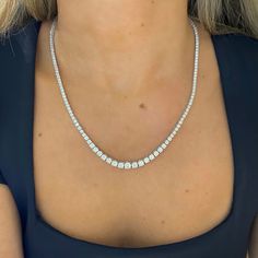 Heads are sure to turn when wearing this exquisite tapered diamond tennis necklace. This opulent arrangement of diamonds set in gold glistens beautifully against the skin. Metal: 14k White Gold / 14k Yellow Gold / 14k Rose Gold Round Brilliant Cut Natural Diamonds: Approx. 10.02 ctw G Color and SI1-2 Clarity Diamonds Length: 18 inches Closure: Box Clasp Looking for a different length? Please email us. Fine Jewelry Cubic Zirconia Tennis Necklace With Brilliant Cut, Fine Jewelry Tennis Necklace With Brilliant Cut Cubic Zirconia, Dazzling Diamond White Round Cut Tennis Necklace, Dazzling Tennis Necklace With Single Cut Diamonds, Dazzling Brilliant Cut White Gold Tennis Necklace, Classic Diamond Cut Moissanite Tennis Necklace, Formal Tennis Necklace With Single Cut Diamonds, Formal Diamond White Lab Grown Diamond Tennis Necklace, Dazzling Diamond Tennis Necklace With Prong Setting