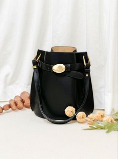 Classic black leather bucket purses for trendy ladies Elegant Bucket Bag With Adjustable Strap For Work, Elegant Workwear Bucket Bag With Adjustable Strap, Bucket Bag With Gold-tone Hardware For Work, Bucket Shoulder Bag With Metal Hardware, Workwear Bags With Gold-tone Hardware And Bucket Shape, Classic Bucket Shoulder Bag With Gold-tone Hardware, Black Leather Bucket Bag With Gold-tone Hardware For Work, Bucket Bag With Metal Hardware For Daily Use, Chic Bucket-shape Shoulder Bag For Work