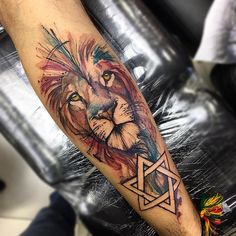 a man with a lion tattoo on his arm