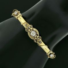 "This beautiful antique bangle bracelet was crafted from solid 14k yellow gold during the Victorian era and features a tube style with a gorgeous diamonds and seed pearls throughout its top. The fine diamonds show a nice size with the largest at the center, with all showing amazing brilliance and spectacular sparkles that are truly eye-catching on this bracelet.The stones sit on fine and open gold work designs that overlap the polished finish bracelet, adorned with adorable seed pearls throughou Antique 14k Gold Bangle, Victorian 14k Gold Bangle, Victorian 14k Gold Bracelet, Victorian Gold Bracelet For Anniversary, Vintage Diamond Bangle Bracelet For Anniversary, Vintage Hallmarked Yellow Gold Diamond Bracelet, Vintage Yellow Gold Diamond Bracelet For Weddings, Vintage Yellow Gold Diamond Bracelet, Vintage Gold Diamond Bracelet