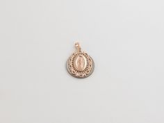 "Fabulous 14k Solid Rose Gold Virgin Mary Miraculous Pendant! Metal Purity: 14k Gold , Stamped , Not plated Length: 3/4\" or 20 mm long Width: Almost 5/8\" or 15 mm wide Weight: 1.50 grams Complementary Gift Box There is a prayer around Mary which says: O Mary conceived without sin pray for us who have recourse to thee. This pendant is about the same size as a dime. Images may be enlarged to show detail and the item may look larger than it appears in person.In order to reduce buyer remorse and r Elegant Miraculous Medal Round Pendant Jewelry, Elegant Round Miraculous Medal Jewelry, Elegant Miraculous Medal Jewelry, Hallmarked 14k Rose Gold Jewelry, 14k Hallmarked Rose Gold Jewelry, Rose Gold Medallion Jewelry With Charms, Oval Rose Gold Charms Jewelry, Rose Gold Medallion Jewelry With Polished Finish, 14k Rose Gold Pendant Jewelry In Gold Color