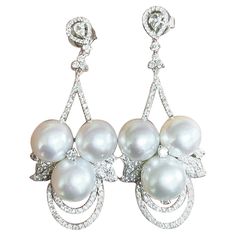 The Following Items we are offering are this Extremely Rare Beautiful 18KT Gold Fine Rare Large South Sea Pearl Fancy Diamond Dangle Drop Earrings. These Magnificent Earrings are comprised of 6 Rare Fine Large AA-AAA South Sea Pearls with Gorgeous Glittering Diamonds!!! T.C.W. Approx 3CTS!! The Diamonds and Pearls are of Exquisite and Fine Quality!! These Gorgeous Earrings are a Rare Sample Pair from a Private Top Manufacturer that sold to Select Five Star Hotels and Fine Jewelry Stores!! Comes New With Tags $18,000. A Pair of Rare Breathtaking Masterpieces!!! Diamonds And Pearls, Diamond Dangle Earrings, Sea Pearl, Fancy Diamonds, South Sea Pearls, Sea Pearls, Gorgeous Earrings, Five Star, Bridal Accessories