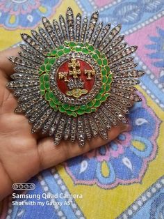 Handmade item Recycling: No Brooch Length: 3.50 Inches Gemstone: Rose Cut diamond & Emerald Brooch weight: 45.700 Grams Enamel:Red & Green Diamond weight: 21.40 carats Diamond colure: Light Tinted Brown Diamond shape: Round Emerald weight: 0.30 carats Material: Silver Sterling silver Purity: 925 Brooch Finished: Antique & Gold Ceremonial Hallmarked Pendant Brooch, Traditional Pendant Brooches For Formal Occasions, Traditional Hallmarked Brooch For Formal Occasions, Traditional Gemstone Brooches For Gift, Traditional Gemstone Brooches As Gift, Traditional Silver Brooches For Formal Occasions, Traditional Green Brooch Jewelry, Traditional Round Brooches For Wedding, Handmade Traditional Brooch For Formal Occasions