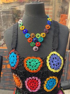 I love to create jewelries. This vibrant colorful boho statement beaded necklace was inspired by the many colors of a Kaleidoscope. In every circle center there is a black lava bead. This beautiful lava beaded rainbow necklace could be a nice present for bohemian style lovers. This necklace is handmade designed by myself. Used materials: traditional Czech glass seed beads 10/0 black lava beads 6 mm. Used technique: Brick stitch .  Please feel free to ask me if you have any questions.  Check out Bohemian Necklace With Large Rainbow Beads, Bohemian Black Bib Necklace With Colorful Beads, Rainbow Large Beads Bohemian Necklace, Festival Multi-strand Colorful Beaded Necklaces, Festival Multi-strand Colorful Beads Necklace, Beaded Rainbow, Boho Beaded Necklace, Boho Statement Necklace, Beaded Angels