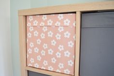 a close up of a bed frame with flowers on it