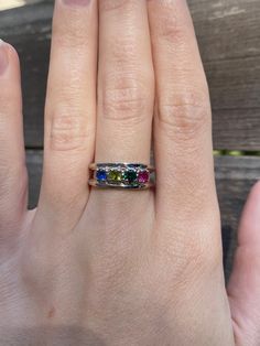 Total Weight: 3.8 grams Size: 7 Band Width: 3-6mm Sapphire: 3.75mm Emerald: 3.75mm Peridot: 3.75mm Spinel: 3.75mm Condition: In great condition showing little wear and no damage. All gold has been thoroughly checked with an Olympus RFK spectrometer. It is guaranteed 14k gold.  All our jewelry is properly washed and disinfected to ensure customers get clean items with every order.  Returns accepted but may be subjected to a restock fee.  Please message with any questions:) Rainbow Multi-stone Birthstone Ring For Anniversary, Anniversary Multi-stone Rainbow Birthstone Ring, Anniversary Rainbow Multi-stone Birthstone Ring, May Birthstone Multi-stone White Gold Jewelry, White Gold Multi-stone Jewelry For May Birthstone, Multi-stone Round Jewelry For May Birthstone, Green Multi-stone Gemstones In 14k Gold, Rainbow Birthstone Rings In Fine Jewelry, Green Sapphire Stackable Ring For Anniversary