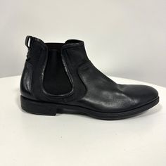 Designer : John Varvatos Size: 10 Made In Italy Black Leather Boot New Without Tag/Box Never Worn Classic Slip-on Boots With Textured Sole, Business Ankle-high Leather Shoes With Leather Lining, Leather Pointed Toe Business Boots, Leather Pointed Toe Boots For Business, Business Leather Boots With Pointed Toe, Formal Chelsea Boots With Round Toe, Black Leather Shoes For Fall Formal Occasions, Black Calf Leather Almond Toe Shoes, Black Calf Leather Shoes With Almond Toe