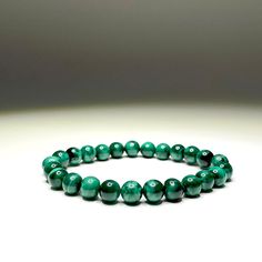 Malachite Beaded Bracelet This item is handmade by Earth's Minerals Inc and is made to order. This listing is for 1 (ONE) Malachite Beaded Bracelet We have 2 options available: -Elastic: we use stretch elastic and size will be about 7 inches -Custom: Bracelet is adjustable, made with a macrame sliding knot. Bracelet circumference: 6 inches Maximum adjustable circumference: 11 inches For different sizes please contact us, otherwise item will be made with our standard measurements Malachite absorb Green Malachite Spiritual Beaded Bracelets, Spiritual Green Malachite Beaded Bracelets, Handmade Green Malachite Bracelets, Handmade Malachite Beaded Bracelets For Spiritual Use, Handmade Malachite Spiritual Beaded Bracelets, Green Malachite Beaded Bracelets As Gift, Green Malachite Beaded Bracelets, Spiritual Malachite Beaded Bracelets With Gemstone Beads, Green Malachite Bracelets With Natural Stones