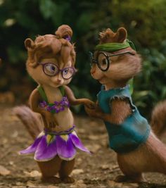 two cartoon characters are dancing together in the woods