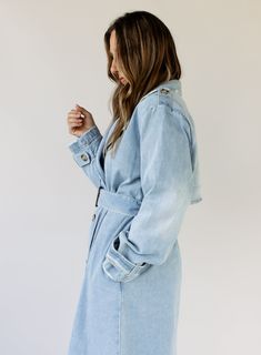 double breasted denim midi trench coat button front closure removable belt pockets long sleeves midweight unlined no stretch 100% rayon hand wash cold Katie is 5’7” wearing size medium small: 46" bust // 46.5" length medium: 49" bust // 47" length large: 52" bust // 47.5" length Button-up Medium Wash Outerwear For Day Out, Medium Wash Button-up Outerwear For Day Out, Double-breasted Denim Outerwear With Button Closure, Double-breasted Denim Jacket For Fall Workwear, Chic Dark Wash Button-up Outerwear, Spring Collared Outerwear With Double Button Closure, Relaxed Fit Washed Outerwear For Spring, Casual Double-breasted Spring Denim Jacket, Chic Collared Denim Jacket For Spring