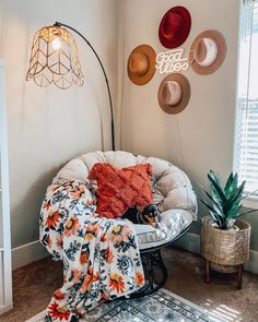 a living room filled with furniture and hats on the wall