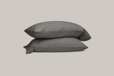 two pillows sitting on top of each other