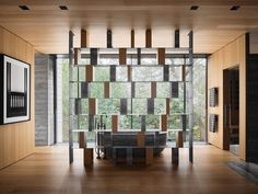 an empty room with wood and glass walls