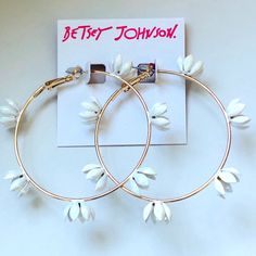 These Betsey Johnson Daisy Flower Hoop Earrings Are Adorned With Multiple Daisies That Encircle The Outer Edge Of The Earrings. Topaz Crystals Adorn The Center Of Each Daisy. Gold Tone Hardware/Crystal Stones Approximately 2" In Diameter Lever Back Closure White Flower Hoop Earrings With Flower Charm, Adjustable White Flower Earrings For Spring, White Metal Jewelry For Spring, White Flower Hoop Earrings For Spring, Chic Small White Hoop Earrings, White Hoop Earrings With Flower Charm, White Hoop Earrings As Spring Gift, Chic White Flower Earrings For Spring, White Hoop Earrings For Spring Party