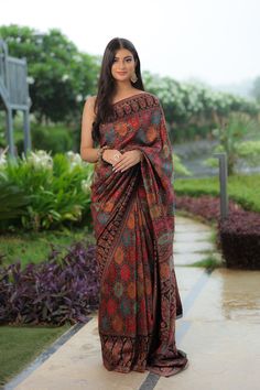 Black Kani saree is crafted in silk fabric and is accentuated all over with Kani Jamawar weaving  in traditional motifs like paisleys and flowers in gorgeous colours. A touch of zari is woven into the threads to add a hint of shine and to the royalty of this gorgeous saree. It comes with a blouse piece in same colour that has Kani weaving in booti pattern.  The design inspiration for this Pashmina Silk saree is drawn from the heritage weaves of ancient Pashmina shawls from Kashmir that date back Luxury Tussar Silk Shawl In Bollywood Style, Luxury Pashmina Traditional Wear For Ceremonies, Multicolor Silk Pre-draped Saree With Zari Work, Navratri Meenakari Tussar Silk Pre-draped Saree, Designer Multicolor Tussar Silk Pre-draped Saree, Elegant Semi-stitched Multicolor Pre-draped Saree, Navratri Katan Silk Pre-draped Saree With Meenakari, Bollywood Style Festive Pre-draped Saree With Kalamkari Print, Pre-draped Tussar Silk Saree With Meenakari For Festivals