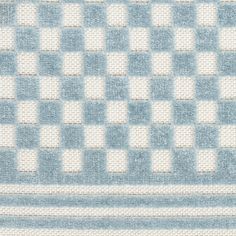 a blue and white rug with squares on it