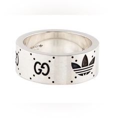 Brand New In Box. 100% Authentic Gucci X Adidas Sterling Silver Logo Ring Ring Size 8 Equals 4.5us Style- 702764 J8400 023 0728 Awesome Gucci X Adidas Ring Made Of Sterling Silver Ring. Semi Shiny Silver (I Magnified The Photos To Show The Size And Markings) Comes Exactly As Shown In Photos. Includes Everything Shown. Box, Jewelry Pouch And Papers. Retail $495 Plus Tax Gucci Sterling Silver Ring For Formal Occasions, Luxury Silver Jewelry With Logo, Designer Silver Jewelry With Logo, Luxury Sterling Silver Jewelry With Logo, Gucci Silver Ring With Polished Finish, Gucci Sterling Silver Ring, Designer Gucci Rings With Polished Finish, Gucci White Gold Luxury Ring, Gucci Luxury Silver Rings