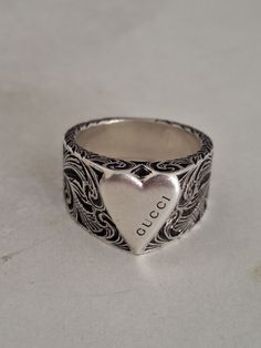 Gucci sterling silver unisex heart shape ring.  Size: 17. Diameter approx. 1.8cm  Marked Ag925. Comes with original box. Made in Italy. Never been used.  Buyers kindly indicate your contact number when making the purchase.  Not responsible for any lost postage or taxes.  All photos were taken under natural lighting. I do not use any filters on my photos. These items were preloved, which means they have a life prior to this. Some imperfections maybe found. I try my very best to show these imperfe Heart Shape Ring, Heart Shaped Rings, Natural Lighting, Heart Shape, Vintage Gucci, Pendant Necklaces, Favorite Jewelry, Heart Ring, Jewelry Necklace Pendant