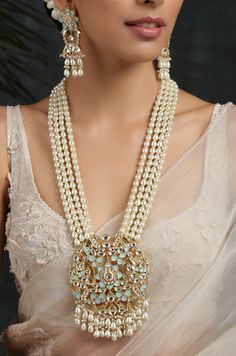 Turquoise Gold Plated Meenakari and Pearl Necklace. This regal Necklace Set is based on material of copper alloy. The four pearl strands end into a beautiful work of meenakari in an intricate floral pattern. the floral pattern is embellished with kundan and pearls ending into a waterfall of pearls. The piece is plated with 22k gold. This beauty is a must in your traditional jewelry collection. LENGTH Necklace Size - 26 inches. Closure - Adjustable Dori. Earring Size- 6 cm DETAILS -100% top Quali Traditional Turquoise Necklace With Meenakari, Traditional Turquoise Meenakari Necklace, Traditional Turquoise Bridal Necklace As A Gift, Temple Jewelry Turquoise Necklaces For Festivals, Turquoise Temple Jewelry Necklaces For Festivals, Traditional Turquoise Necklace For Celebration, Turquoise Kundan Necklace With Meenakari Detailing, Turquoise Kundan Necklace Temple Jewelry Gift, Traditional Kundan Necklace In Turquoise