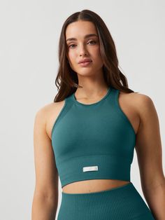 Studio Seamless Bralette - Mallard Blue | Björn Borg Stretch Ribbed Racerback Sports Bra, Medium Support Ribbed Tank Top For Sports, Ribbed Stretch Racerback Activewear, Ribbed Medium Support Tank Top For Sports, Compressive Ribbed Sports Bra, Ribbed Racerback Sports Bra For Workout, Sports Ribbed Tank Top With Medium Support, Functional Seamless Medium Support Tank Top, Functional Seamless Tank Top With Medium Support