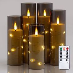 a group of lit candles sitting next to each other