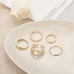 Complete your jewelry collection with this stunning set of rings boasting a variety of textures to add interest to your ensembles. Includes two simple band rings, one chain ring, one twist ring & one geometric ring (five pieces total) Size range from size 2.5 to 6 Face height range from 0.12'' H to 0.43'' H Goldtone copper Set Of Rings, Rings Sets, Hollow Ring, Simple Band, Geometric Type, Ring Fashion, Geometric Ring, Twist Ring, Finger Rings