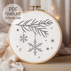 an embroidery pattern with snowflakes on it