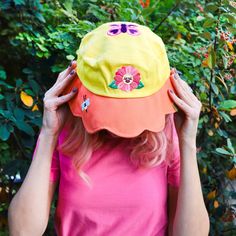 Channel your inner garden fairy by wearing a flower as a hat. There’s nothing more stylish than nature itself! This smiling flower’s pink petals can protect you from the sun’s harmful rays and will also make you look super precious.🌸 Includes one (1) adult bucket hat with whimsical embroidery all around. 🌸 Inside measures around 7"🌸 Adult size O/S🌸 Unique pattern on the inside and outsideDesigned in sunny Tucson, AZ. 20% Cotton 80% PolyesterWe recommend hand-washing only. Whimsical Embroidery, Smiling Flower, Inner Garden, Turtley Awesome, Floral Bucket Hat, Garden Fairy, Pink Petals, Tucson Az, Yellow Floral