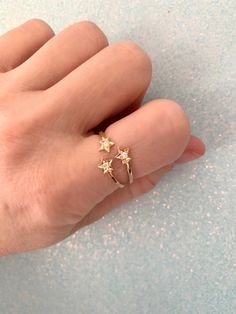 100% handmade 14k solid gold three star diamond ring. The trinity ring is so beautiful and looks stunning worn alone or stacked with your other favorite rings. every item is individually gift wrapped in a cute box with washi tape and a sticker 🎀💝 100% hand made in Los Angeles California with love 💕 🌴 Gold Star-shaped 14k Diamond Ring, Star-shaped Yellow Gold Diamond Promise Ring, 14k Gold Star-shaped Celestial Rings, 14k Gold Celestial Star Ring, Celestial Star-shaped 14k Gold Rings, 14k Gold Star-shaped Ring For Gift, Fine Jewelry Star-shaped Diamond Ring For Gifts, Star-shaped Diamond Ring For Gift, Dainty Rings With Single Cut Diamonds